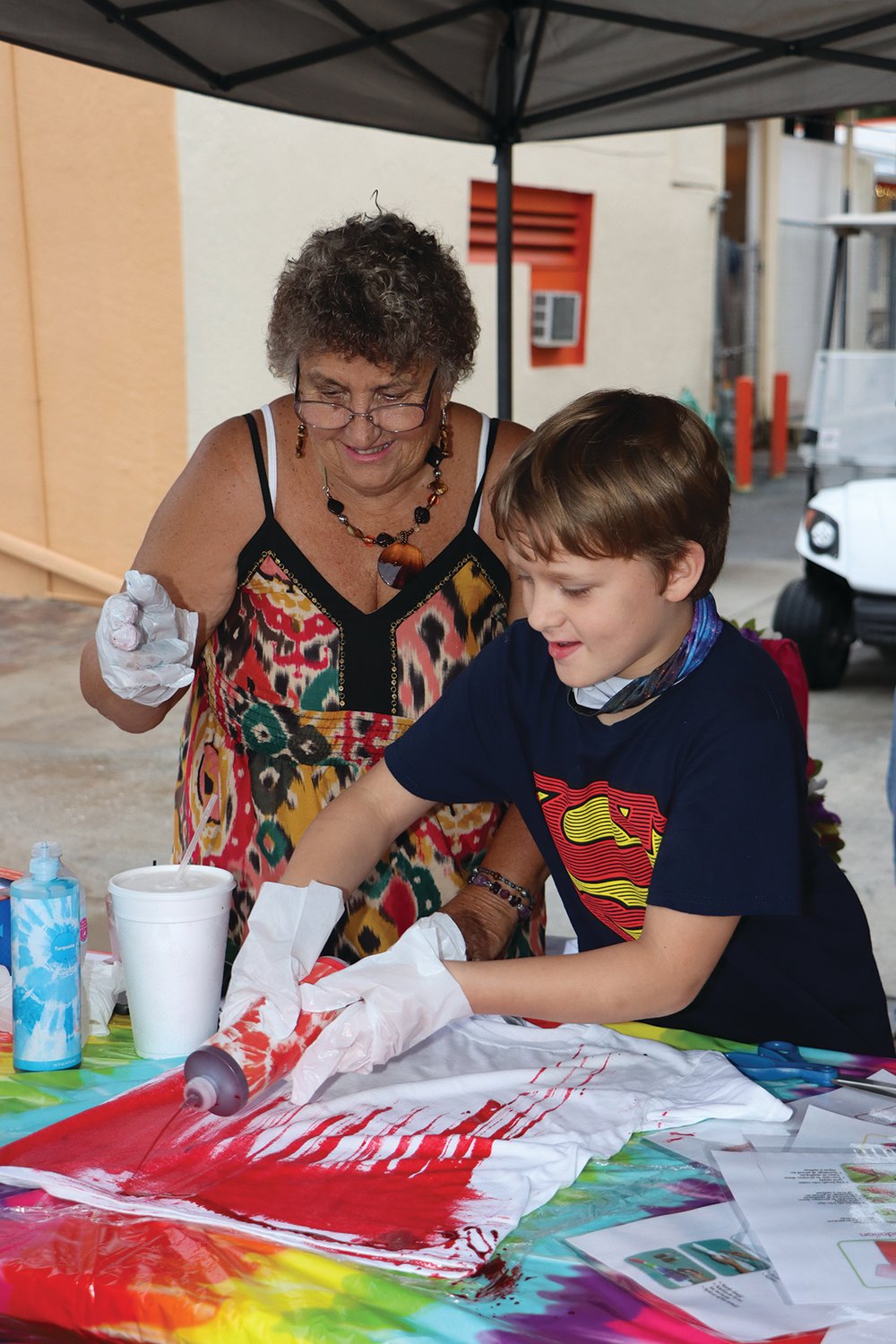 Pictured at the shirt tie-dying station are LDRC board member Christine Eaton and Eli Austin.